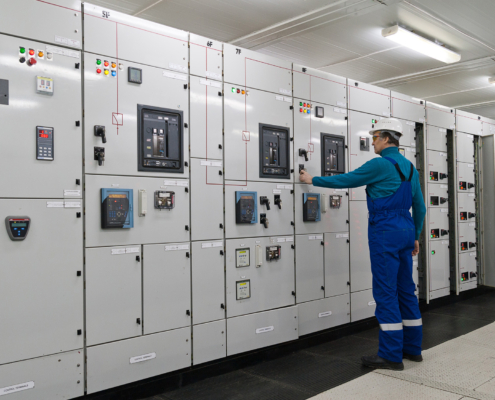 Worker Inspecting Switchgear