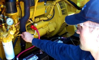 profile and right hand of man adjusting a generator