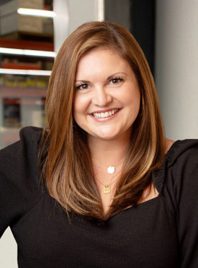 smiling woman in a black blouse